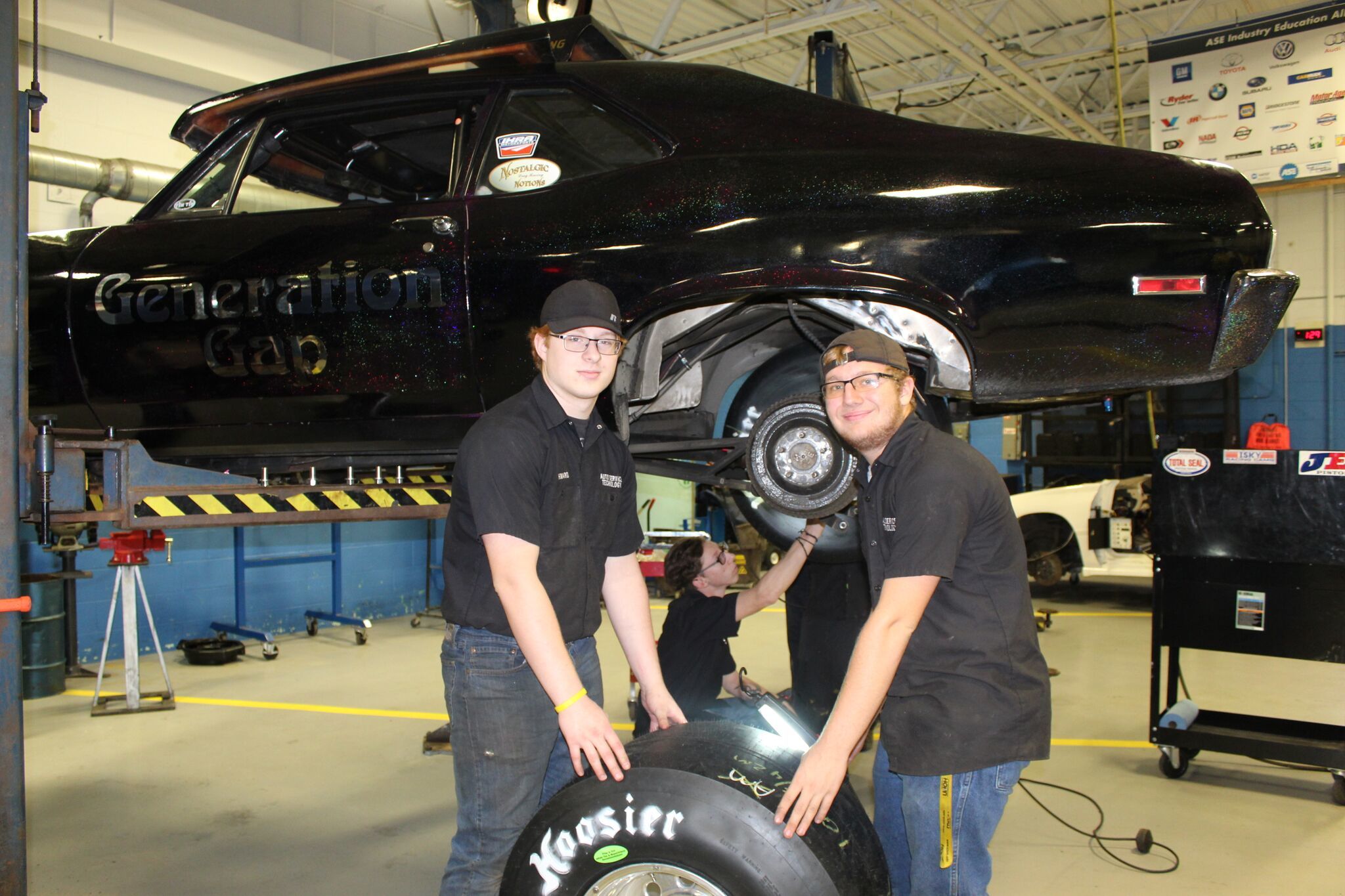 Auto Service students changing tires