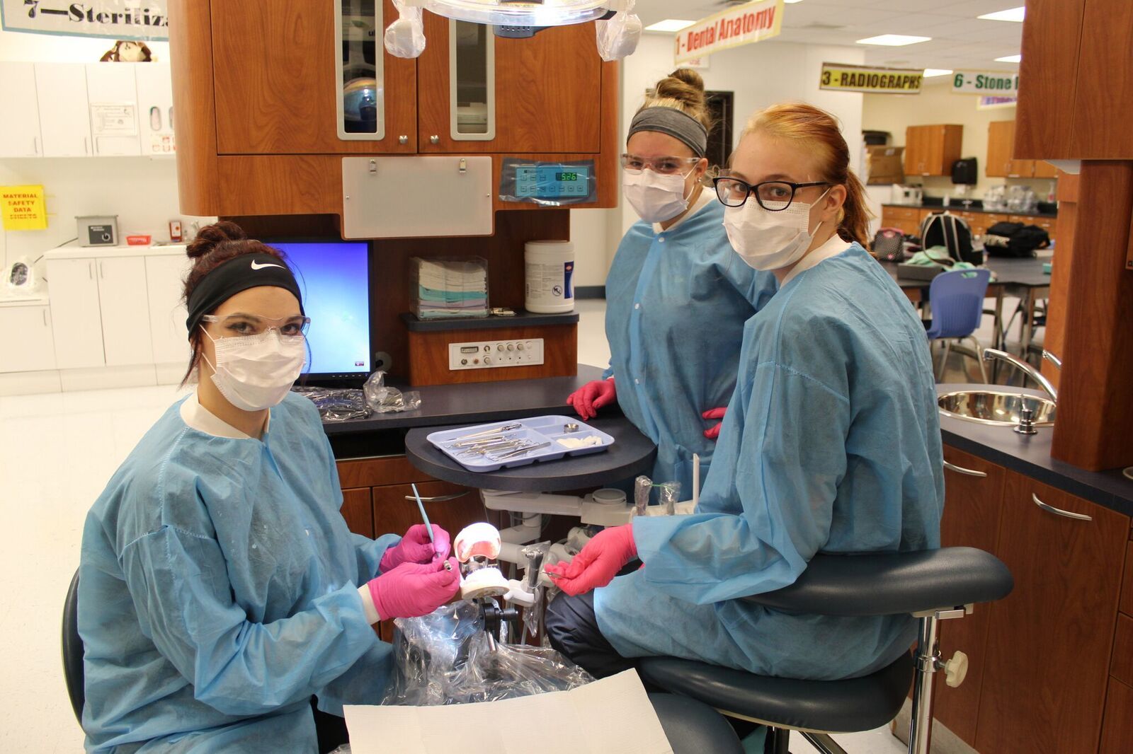Dental Students working in operatory