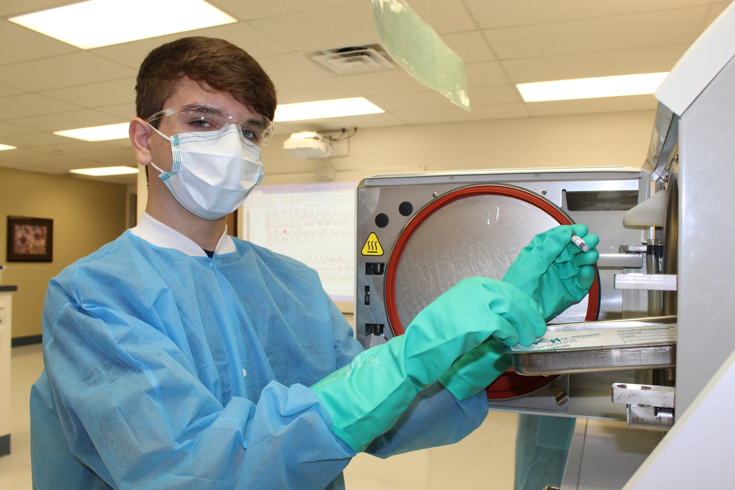 Dental Assisting student sterilizing equipment